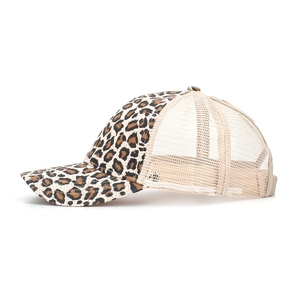 Side view of leopard print baseball cap featuring breathable beige mesh and curved brim