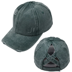 Detail of dark grey-green washed baseball cap with distressed holes and X-shaped ponytail opening