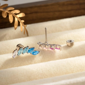 Elegant gradient marquise zircon stud earrings in silver finish on beige velvet