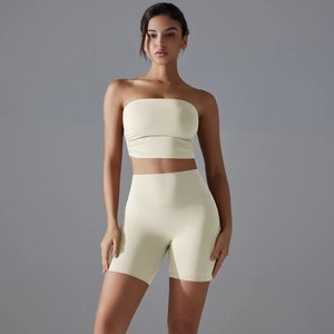 Women's two-piece seamless yoga set with cream yellow sports bra and high-waist gym shorts
