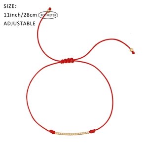 Handmade red braided cord bracelet with thirteen gold cylinder beads and adjustable clasp