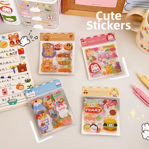 Detailed view of four cartoon sticker sets featuring bears, rabbits, and puppies for journaling