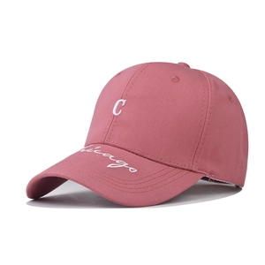 Detail of dry rose pink baseball cap with white 3D letter C and Chicago embroidery