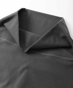 Macro shot of dark grey yoga wear fabric with high elasticity and fine double-needle stitching