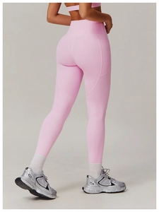 Close-up of pink high-waisted yoga pants with contoured seams for lifting and shaping