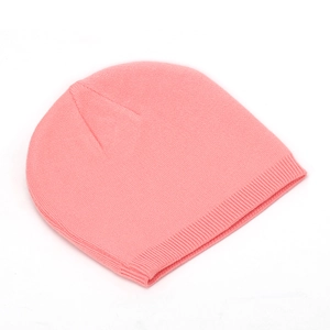 Detailed close-up of pink knitted beanie texture with rib-knit cuff for winter warmth