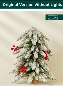 Detailed view of flocked mini Christmas tree with red berries, pine cones and wooden base