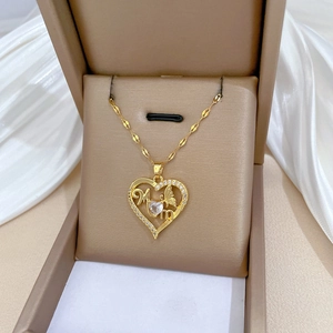Golden butterfly heart Mom necklace with cubic zirconia gems on silk in a gift box