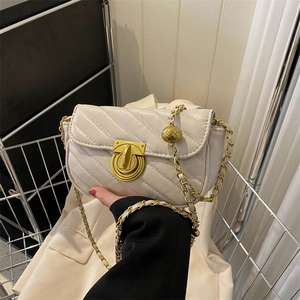Chic beige V-quilted crossbody bag with a gold chain strap and metal ball adjuster
