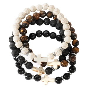 Stack of four beaded bracelets with white turquoise tiger eye and a cross charm