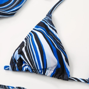 Close-up of blue marble stripe triangle bikini top with ruched texture and halter ties