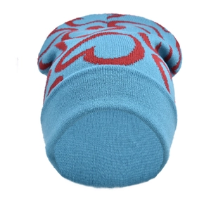 Detailed close-up of light blue knitted beanie with red abstract patterns and wool texture