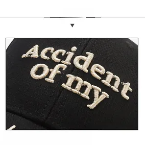 Detailed macro view of 3D embroidery stitching on black cotton twill baseball cap