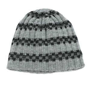 Detail of gray and black striped knit texture on thermal winter beanie for outdoors