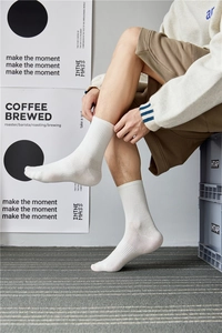 Detail of ribbed white crew socks showing breathable cotton texture and snug fit