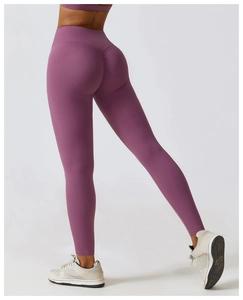 Close-up of high-waisted fitness leggings with scrunch butt detail in dusty pink