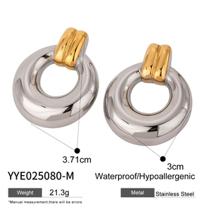 Detail view of geometric circle earrings in gold and silver finish with size specifications