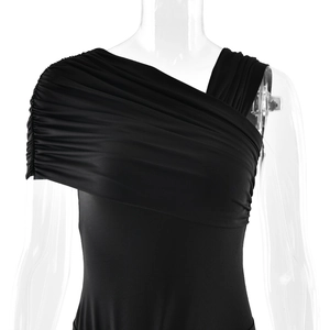 Detail of elegant black off-shoulder dress with ruched shoulder on transparent mannequin