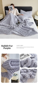 Close-up of thick purple rabbit fur flannel blanket with carved stripe texture and pillowcase