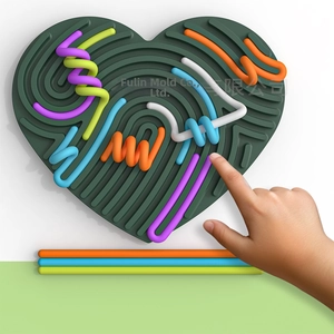 Macro shot of colorful silicone strings on a heart-shaped sensory activity board for kids