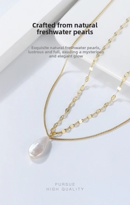 Detail of s925 silver double layer necklace with a baroque teardrop pearl pendant