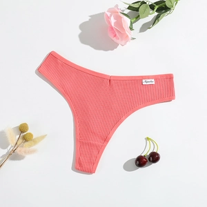 Macro detail of ribbed cotton thong in coral pink with floral and cherry decoration