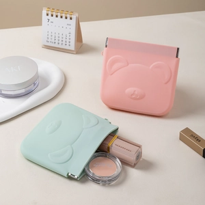 Portable silicone mini storage pouch with cute bear design in pink and mint green colors