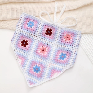 Detail of hand-crocheted granny square headscarf with 3D floral embroidery patterns