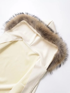 Detailed close-up of premium detachable faux fur collar on off-white hooded sweatshirt