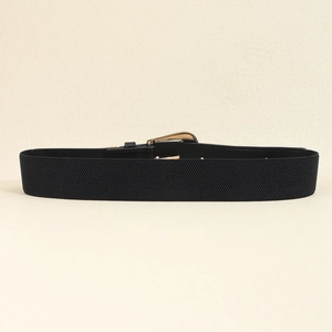 Close-up of a wide black elastic belt featuring a geometric gold metal buckle