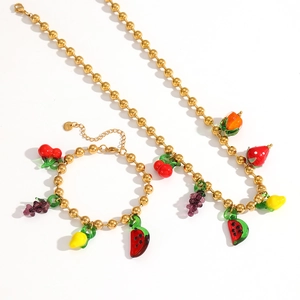 Detail of beaded jewelry set with colorful cherry strawberry and lemon fruit charms