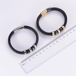 Braided leather bracelets in black with magnetic clasp shown measured at 20cm length