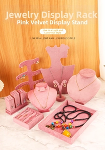 Detailed set of pink velvet jewelry display stands with necklace bust and earring holders