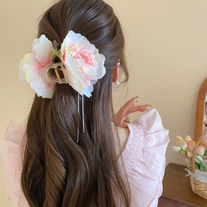 Floral hair claw with fabric pink peony flowers and sparkling rhinestone tassels