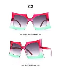 Detailed front and side views of oversized gradient pink to green butterfly sunglasses