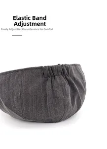 Detail view of the herringbone wool texture and adjustable elastic band on newsboy cap
