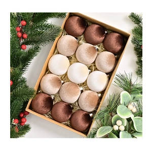 Set of 15 velvet Christmas ball ornaments in earth tones displayed in a kraft gift box