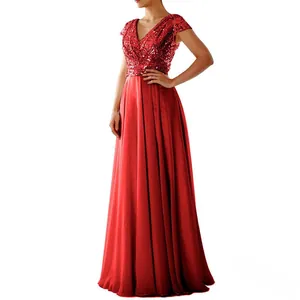 Detail of red sleeveless V-neck evening gown featuring sequined bodice and satin skirt