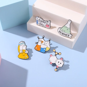 Detail view of colorful science laboratory enamel pins with flasks and test tubes