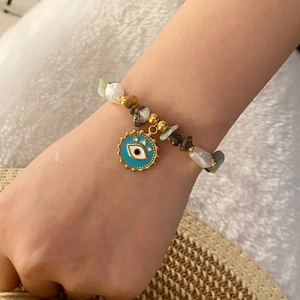 Natural stone and pearl beaded necklace set with a blue evil eye heart pendant charm