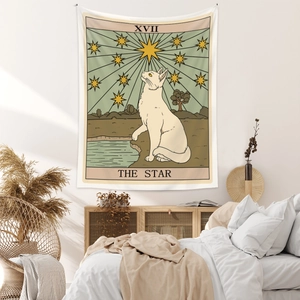 Detail of tarot star white cat tapestry hanging on a cozy bohemian bedroom wall