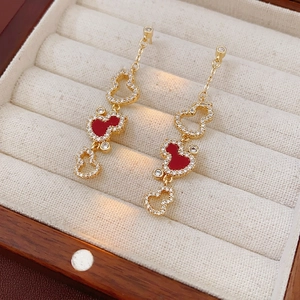 Gold-plated heart tassel earrings with red enamel and zircon stones in a velvet box