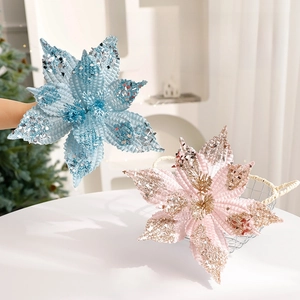 Pink and light blue velvet Christmas poinsettia flowers with glitter and sequins