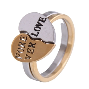 Interlocking heart-shaped couple rings in gold and silver with Forever Love engraving