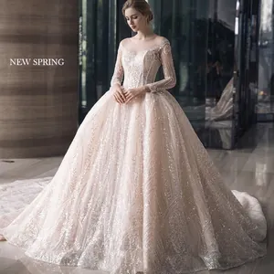 Elegant off-shoulder long sleeve bridal gown with sequins and long train