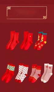 Detail of seven distinct festive red cotton socks with traditional Chinese patterns