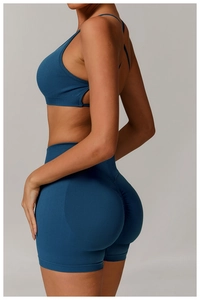 Detail of high-waist yoga set with navy sports bra and scrunch leggings seamless fabric