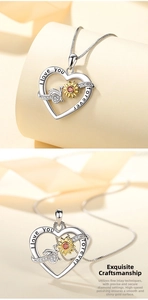 Detail of s925 sterling silver heart necklace with sunflower bee and love engraving