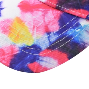Macro detail of the cotton twill visor with multi-color star-sky tie-dye and triple stitching