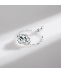 Macro detail of S925 silver adjustable chain ring with flower-shaped zircon clusters